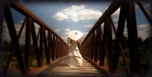 Bride with parasol. Photo by Ralph Heinze Photography