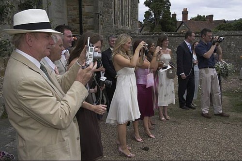 wedding guests taking photos