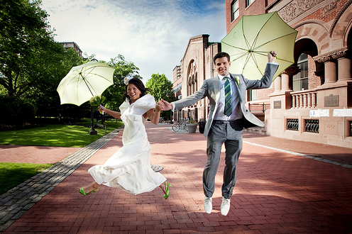 bride and groom with parasols
