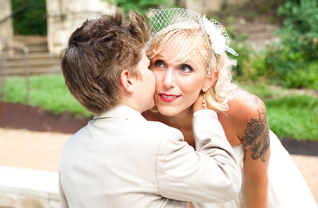 child kissing bride