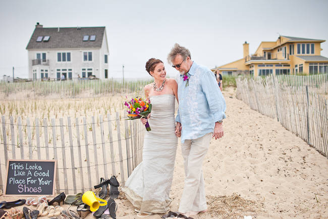 Real Weddings Gia Taylor S Intimate Beach House Wedding Bride Walking Down The Beach With Her Father