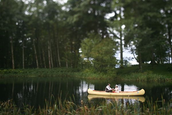 bride and groom in a canoe
