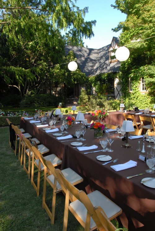 Intimate wedding reception in the gardens of a gorgeous Tudor estate in the hills above Napa Valley. Photo courtesy of Susan Adler Photography