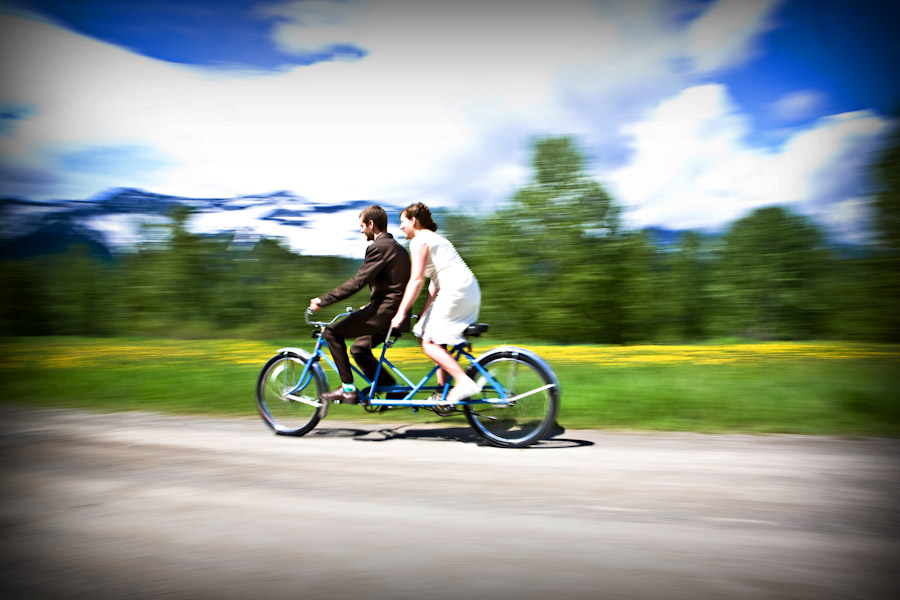 bride and groom on bicycle
