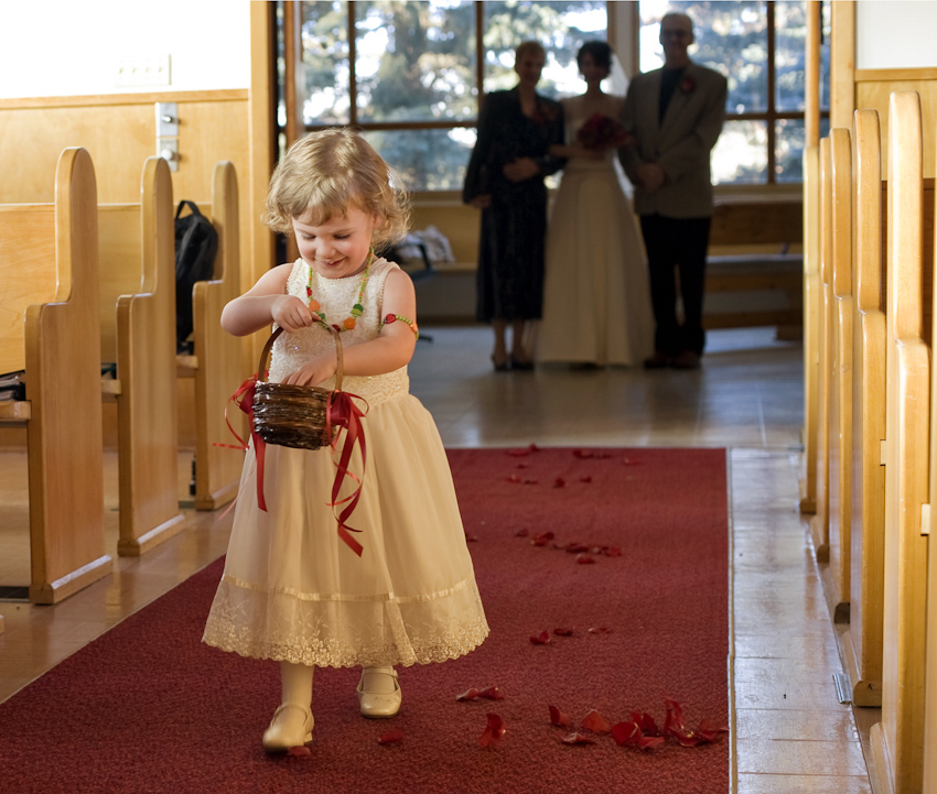 flower girl walking down aisle