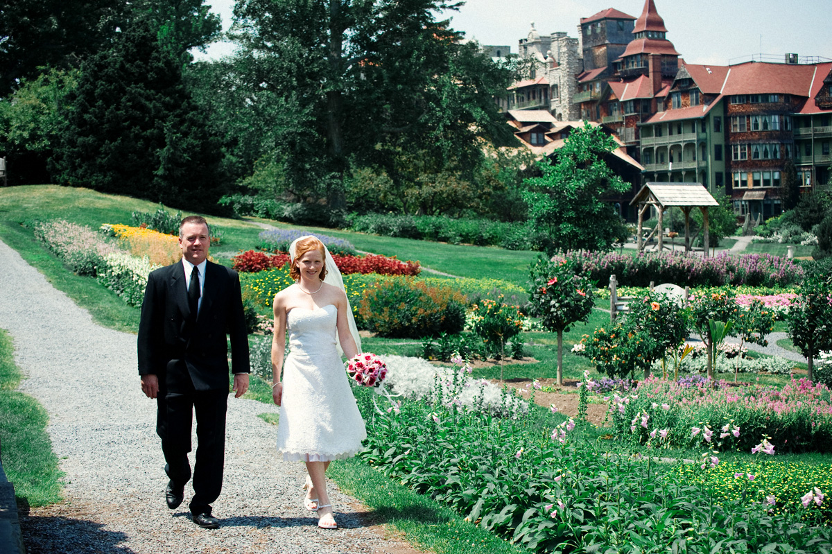 bride walking down aisle outdoors