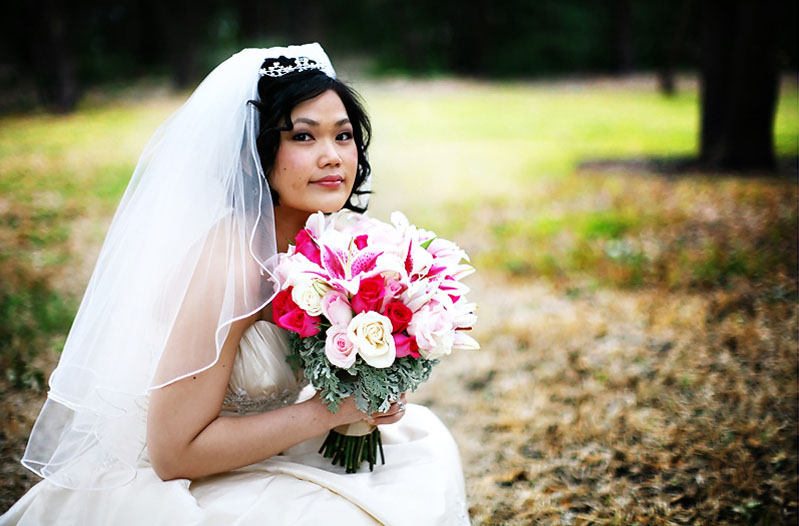 bride holding rose bouquet