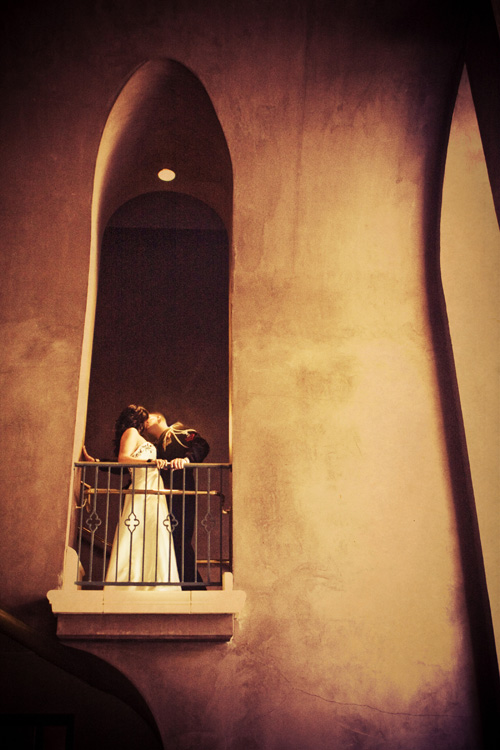 bride and groom on balconey