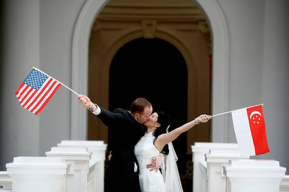 bride and groom with flags