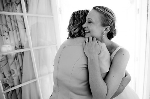 mother daughter wedding hug