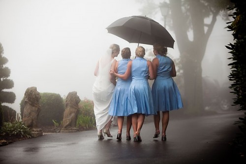 bridesmaids with umbrella