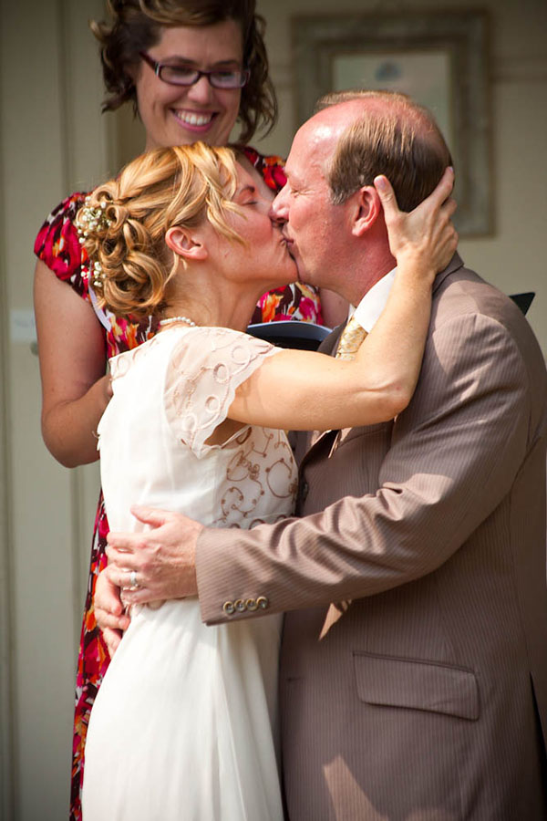 couple kissing on porch