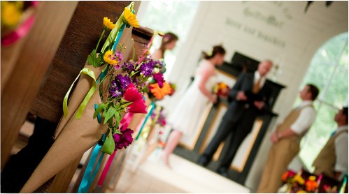 wedding flowers on pew