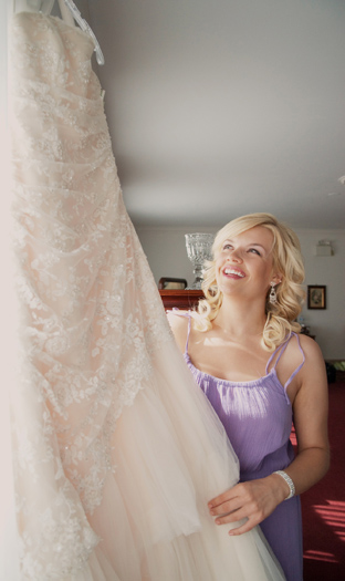 bride looking at her wedding gown