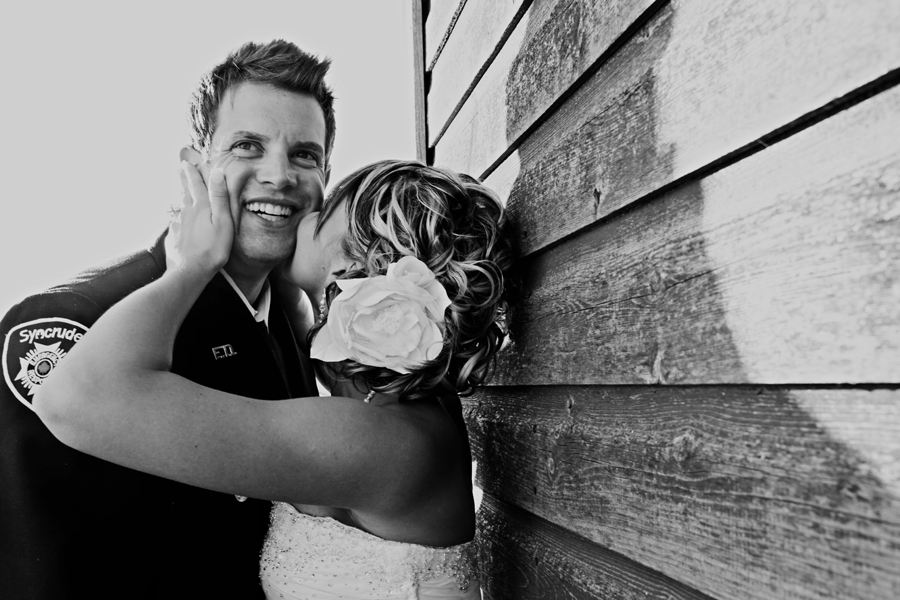 Bride kissing groom