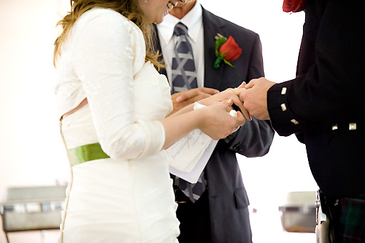 bride and groom holding hands during ceremony