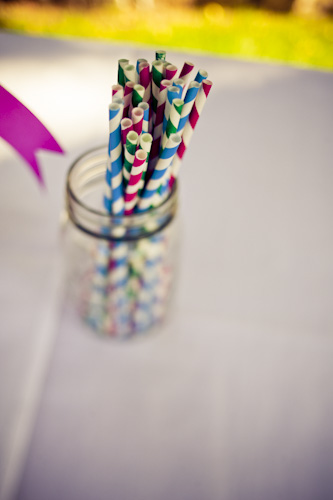 colorful striped straws in a mason jar