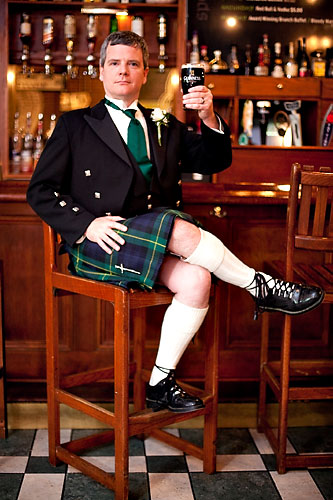 kilted groom in pub