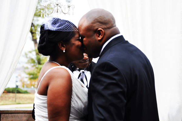 bride and groom kissing at ceremony