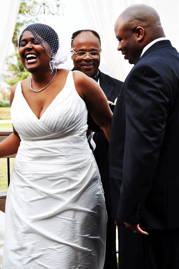 bride laughing during ceremony