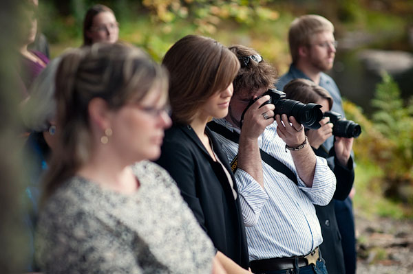 guests photographing wedding