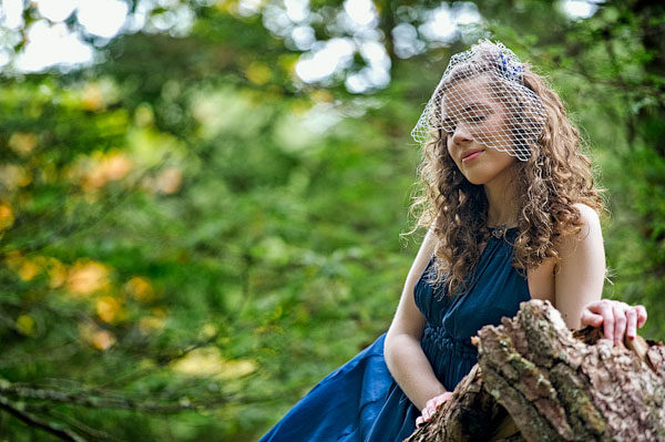 bride in blue wedding dress and birdcage veil