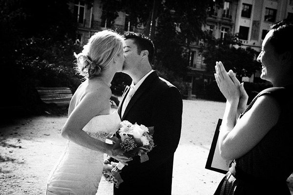 bride and groom first kiss in Paris