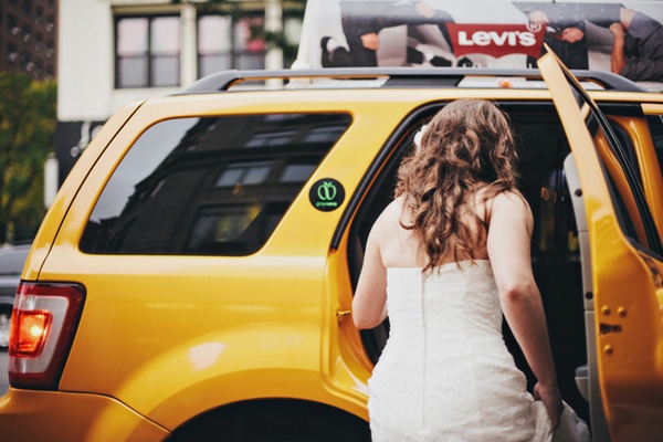 bride getting into New York taxi