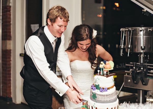 bride and groom cutting wedding cake