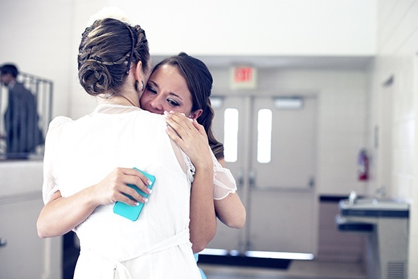 tearful bride hug