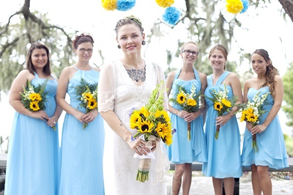 Blue bridesmaid dresses and sunflower bouquets