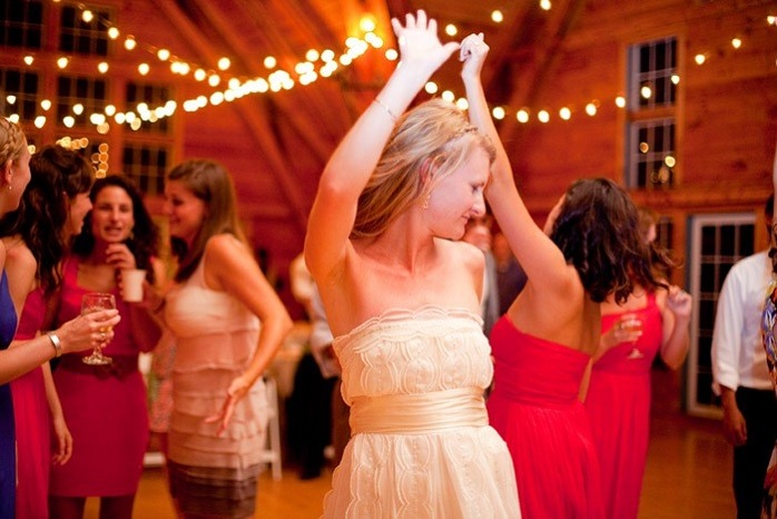 real-intimate-wedding-bride-dancing-with-guests-barn-wedding