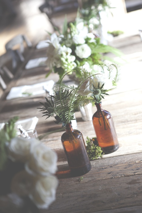 intimate-wedding-reception-glass-bottles-centerpiece