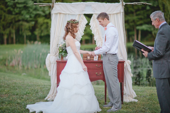 bride and groom exchanging rings