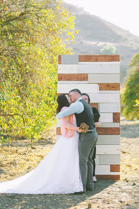 bride and groom first kiss