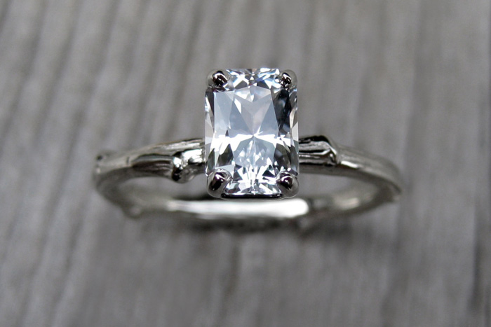 emerald cut white sapphire engagement ring