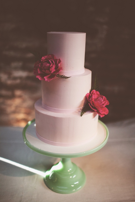 white wedding cake with pink peonies