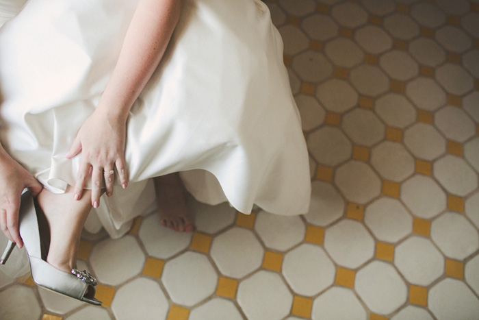 bride putting on her shoes