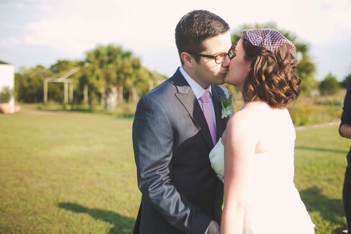 bride and groom first kiss