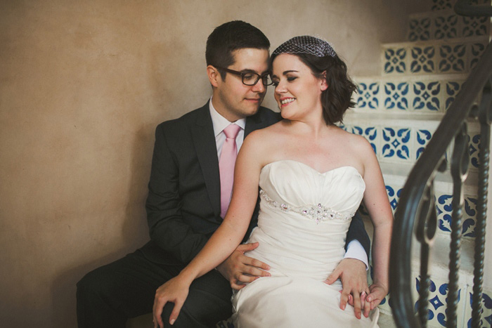 bride and groom on spanish tile steps