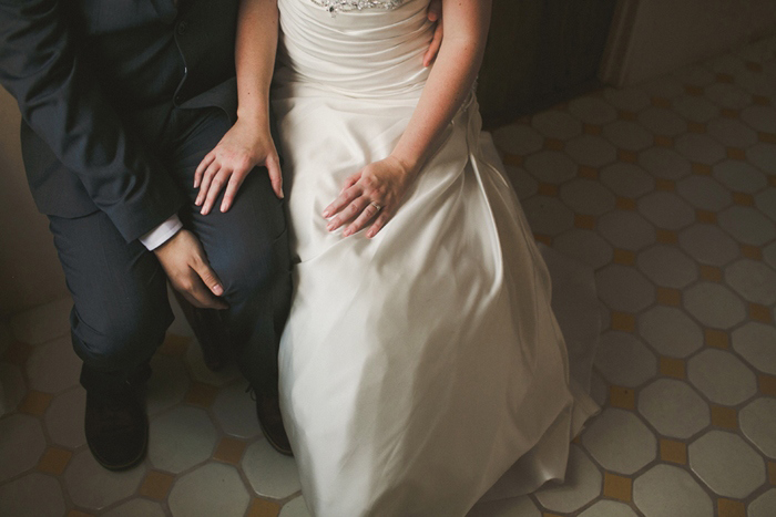 bride's hand on groom's knee