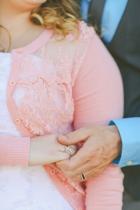 bride and groom holding hands