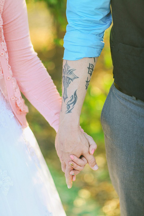 bride and groom holding hands