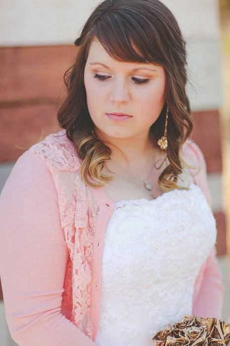 bride in pink cardigan