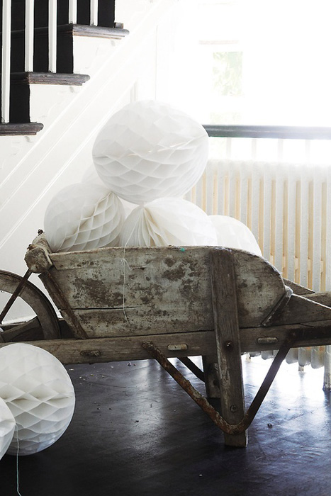 white honeycomb balls in a wheelbarrow