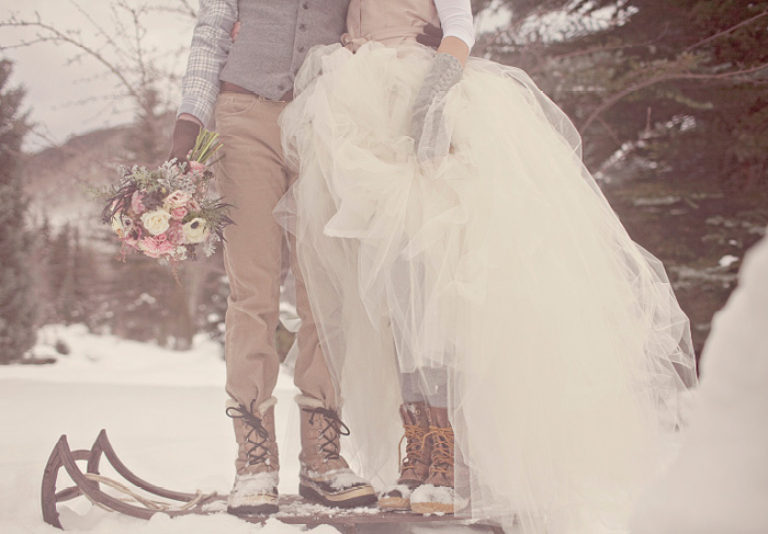 bride and groom in winter boots