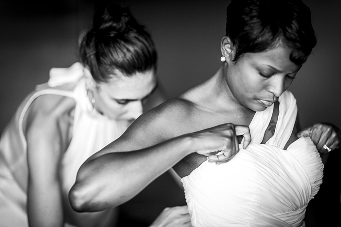 bride adjusting wedding dress