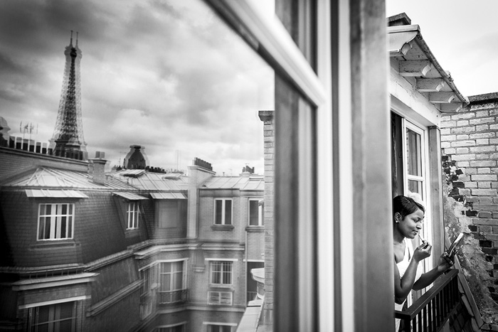 bride leaning out Paris wedding