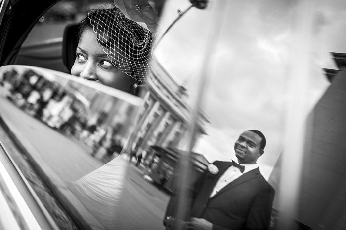 groom's reflection in car window