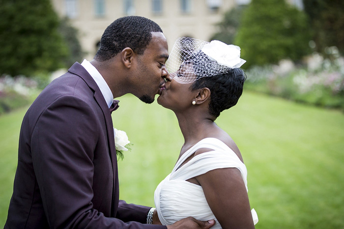 bride and groom first kiss in Paris